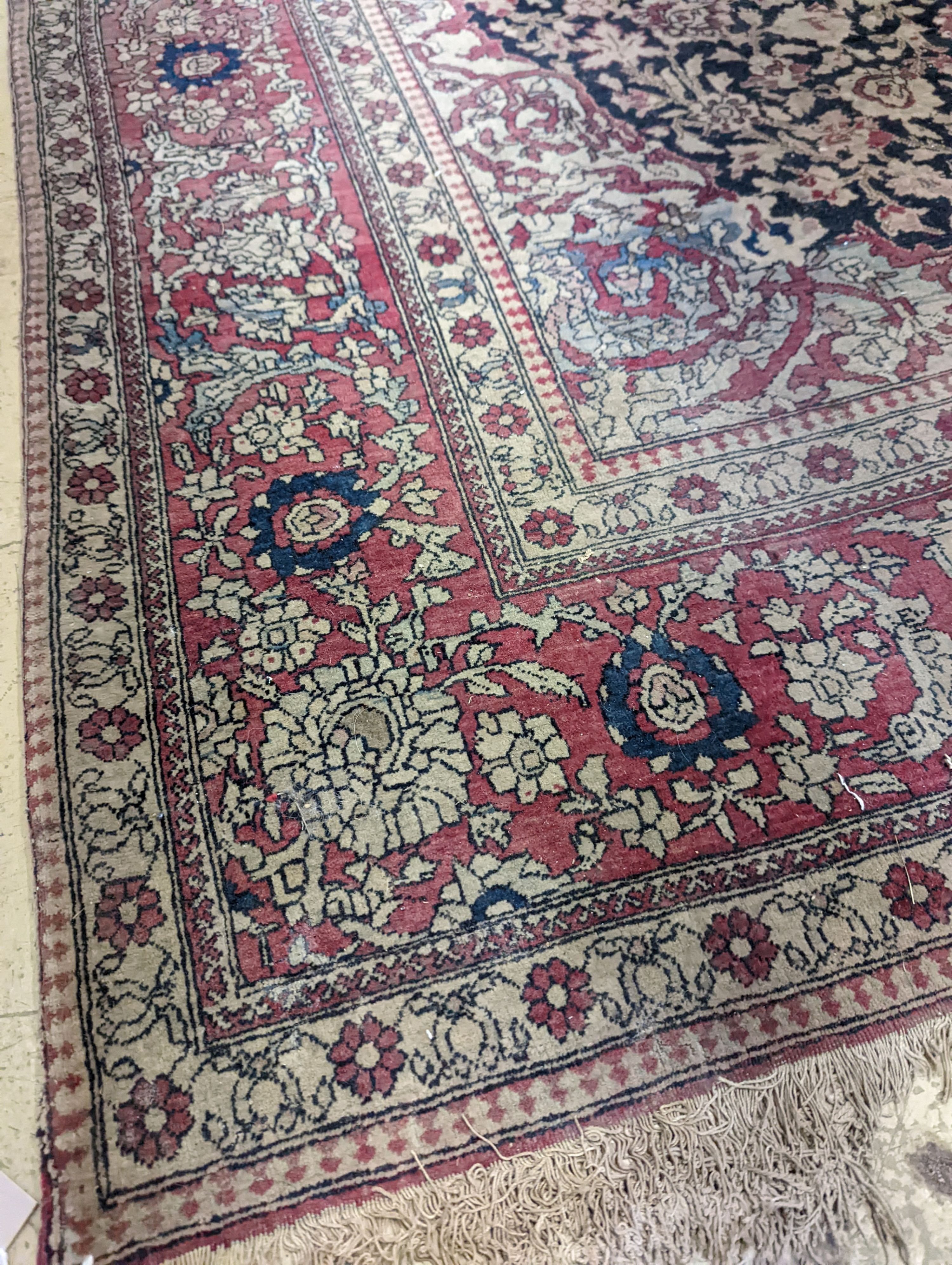 An Isphahan black ground rug with central foliate medallion, mulit-bordered, 202 x140cm